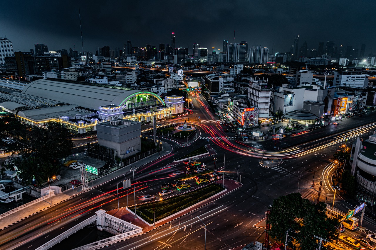 a cityscape with railway station and complex road crossings